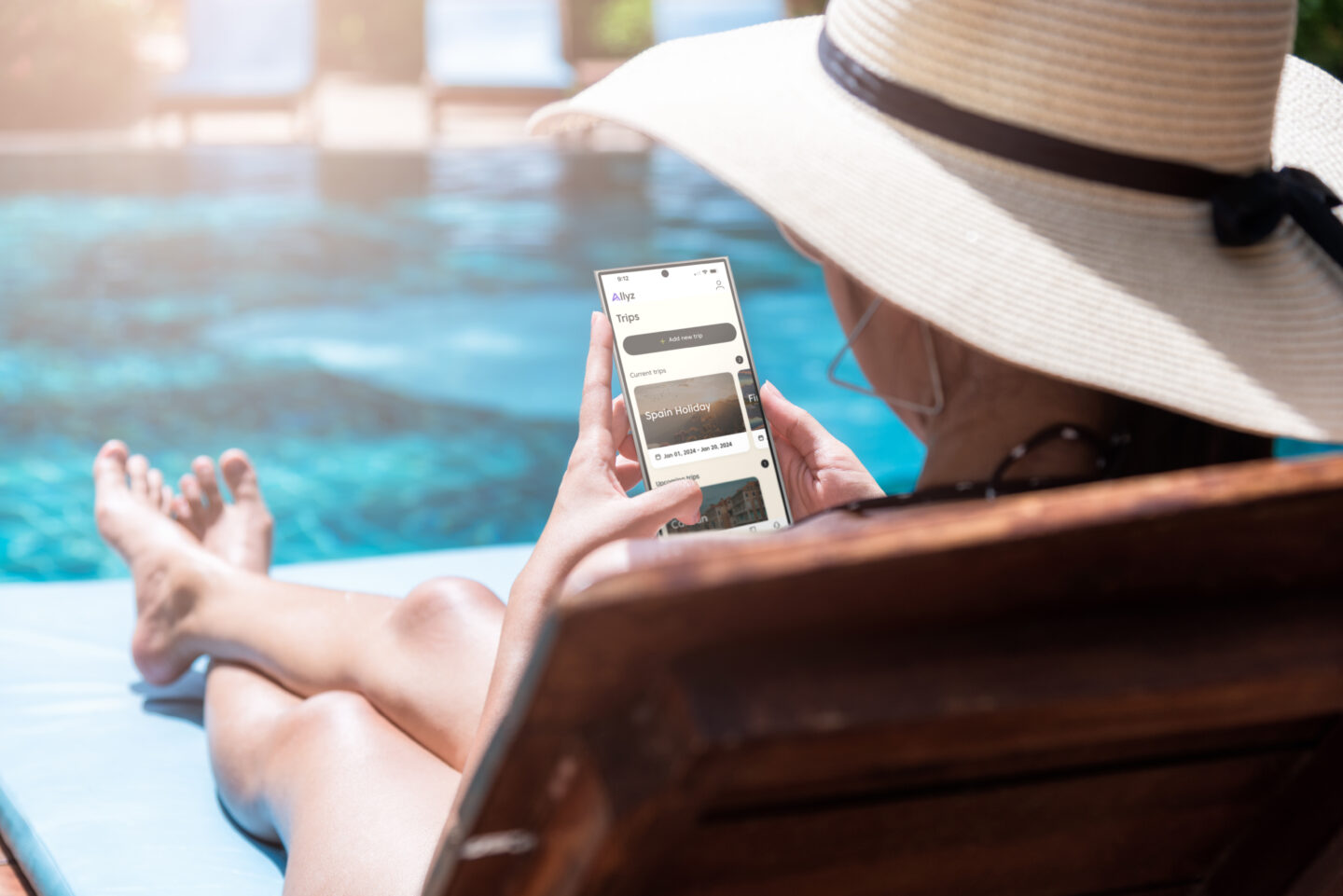 Lady on poolbed looking at app