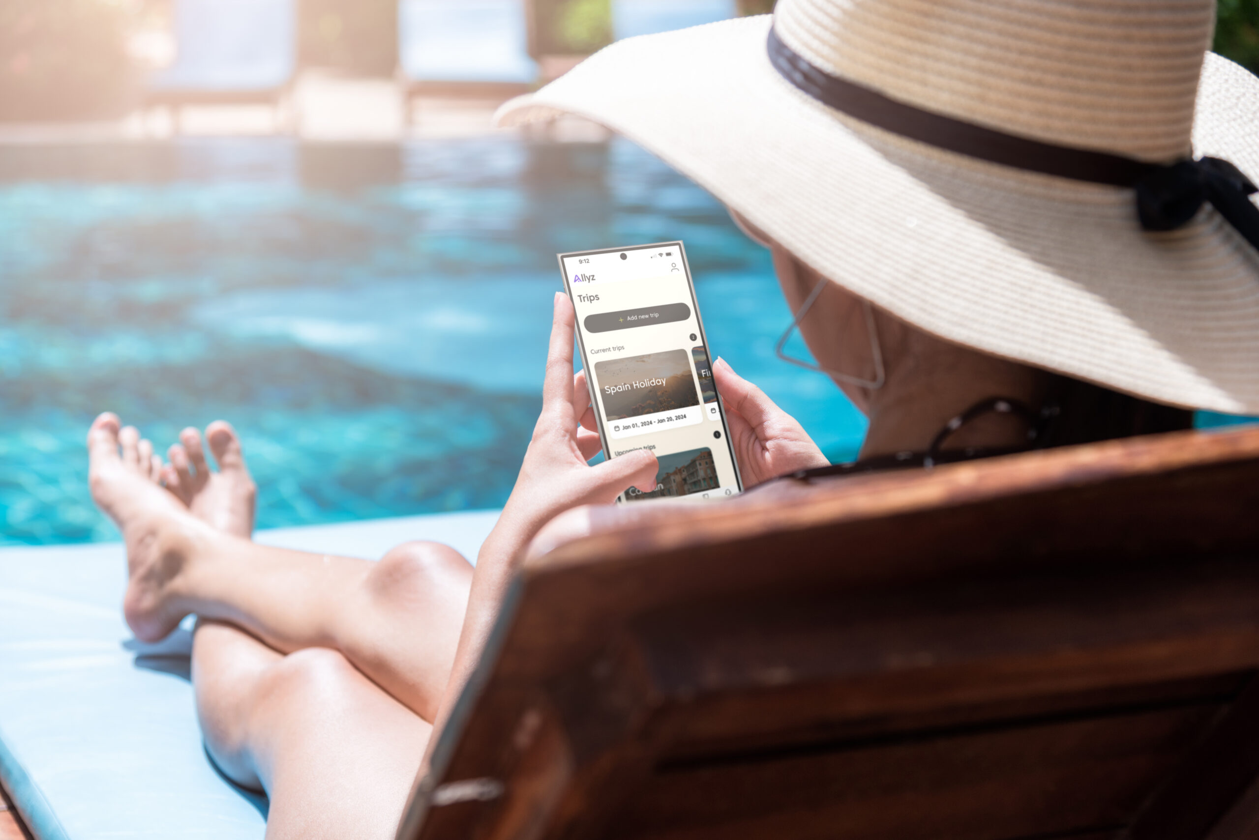 Lady on poolbed looking at app