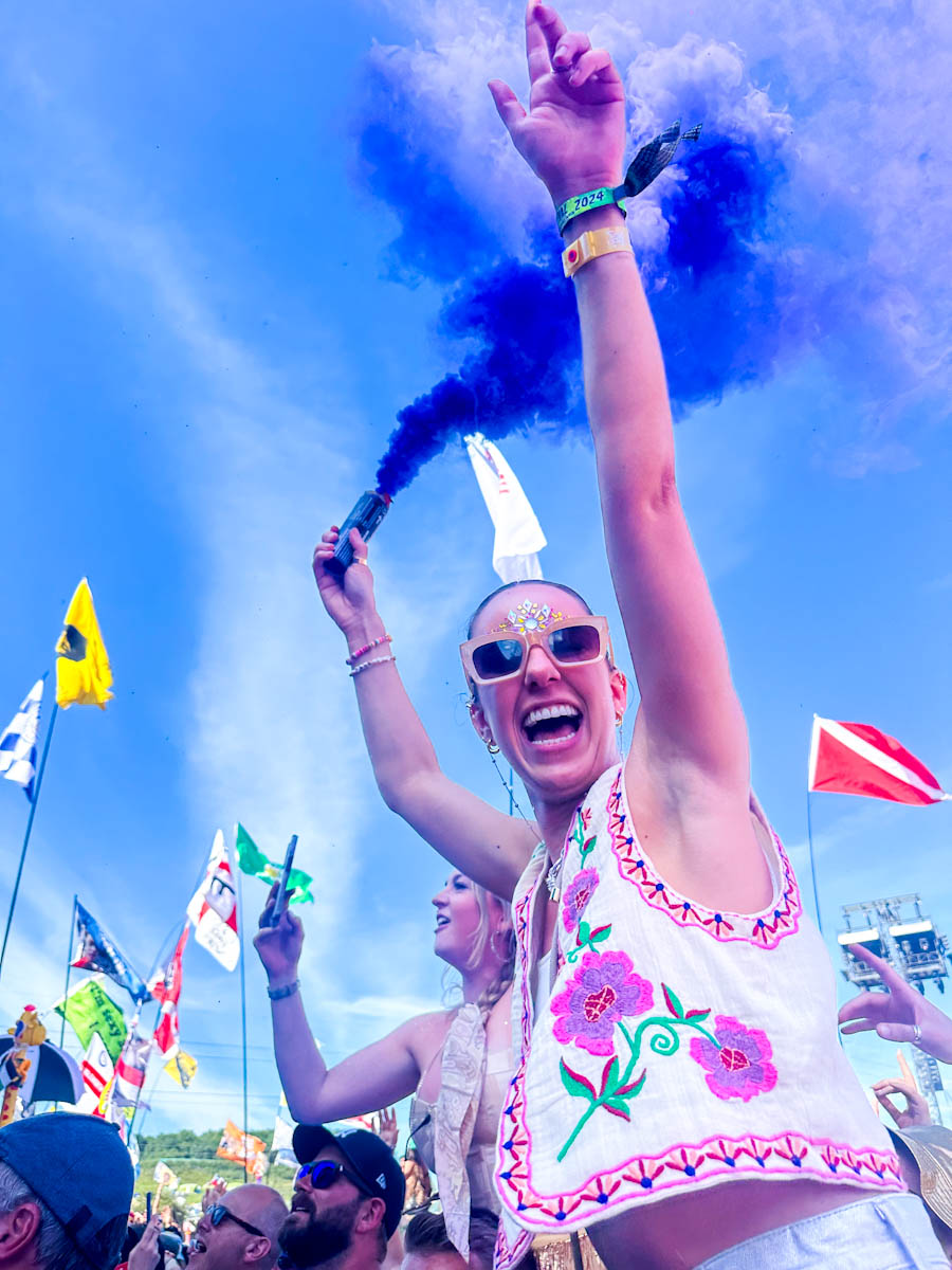 Girl with flair in the crowd Glastonbury 2024