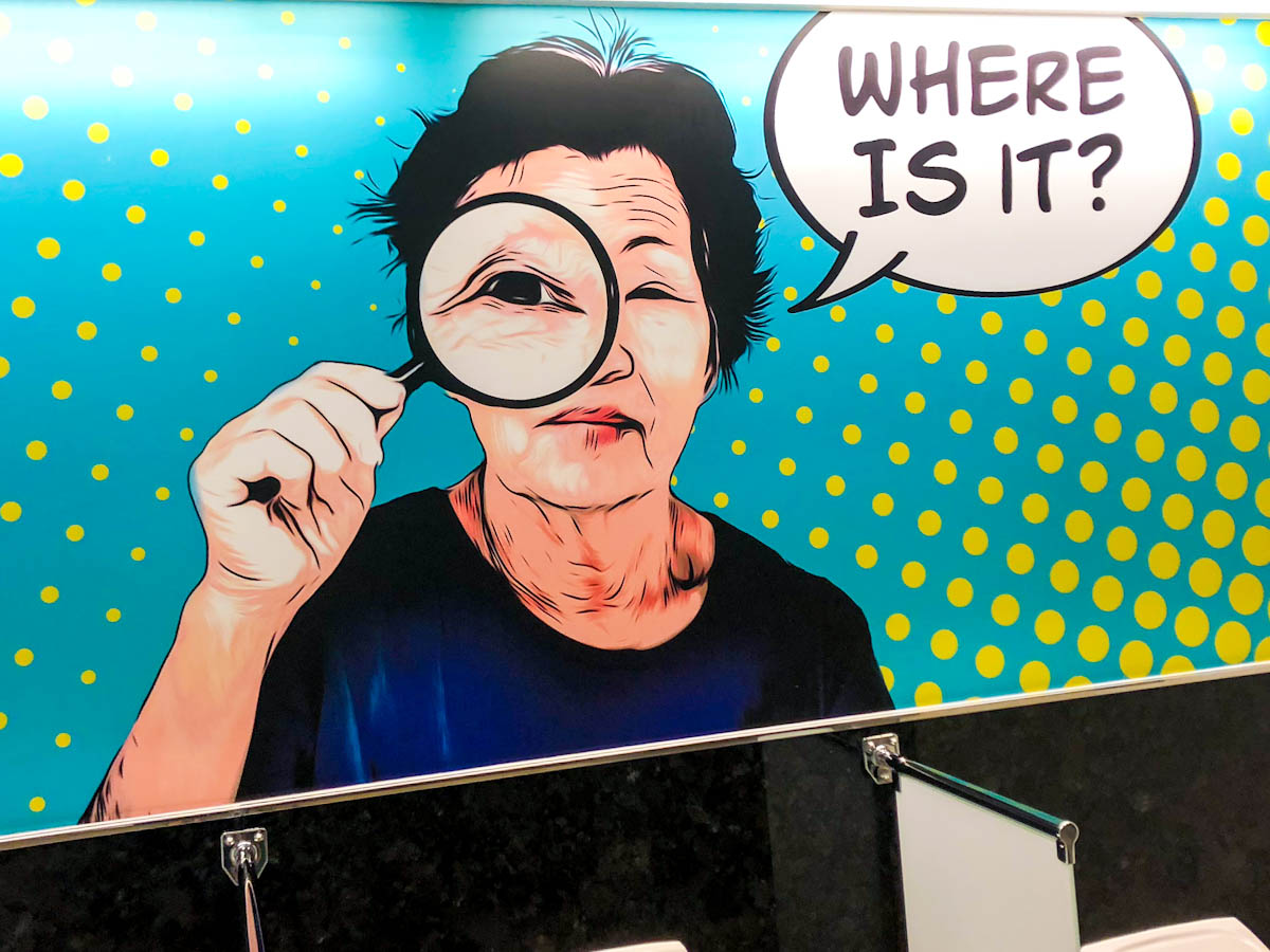 Art work in Men’s urinal with lady saying “where is it?”