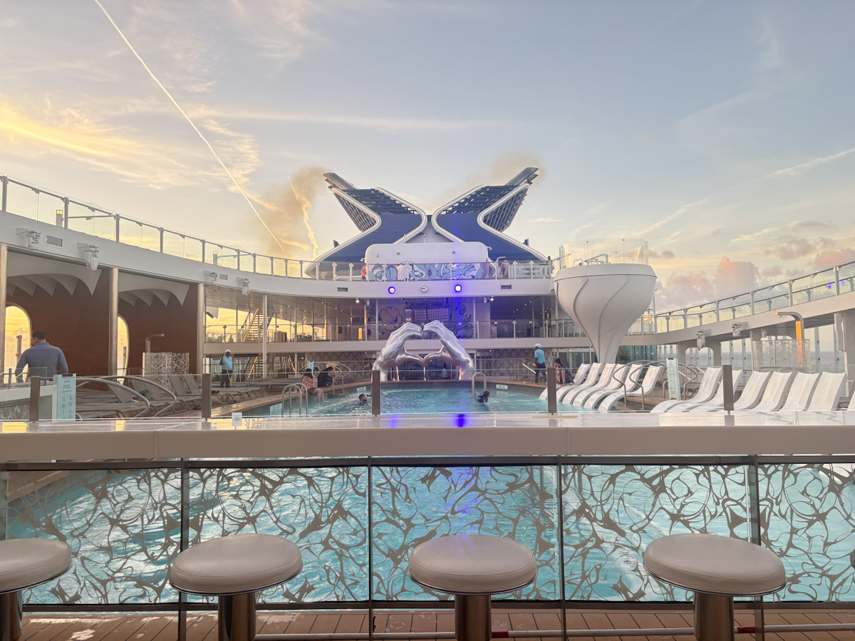 Celebrity Apex pool deck at dusk